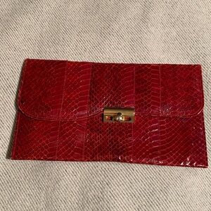 Snake skin purse. Vintage. Burgandy with gold clasp